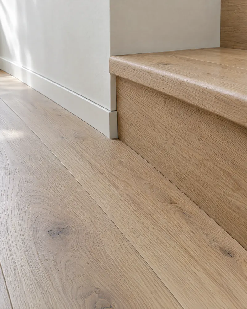 Concept visualization of oak flooring meeting a flush stair nosing